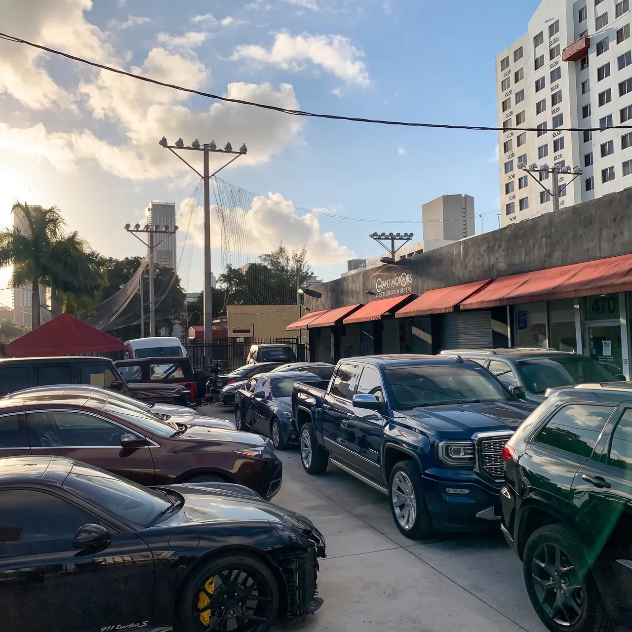 Cars parked at the Giant Motors shop on NW 5th Street